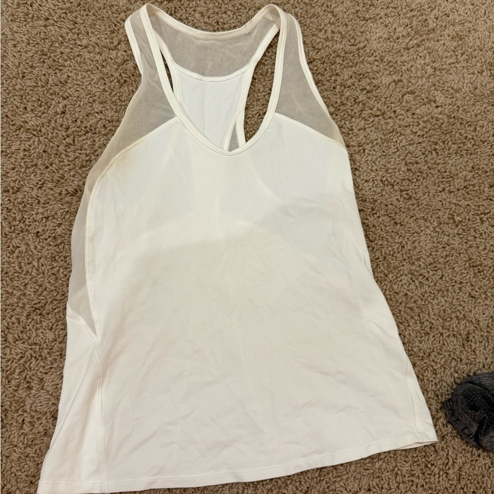 Lululemon Athletica White Tank! Very flattering-old style but still cute